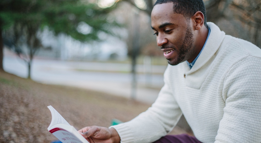 man reading book